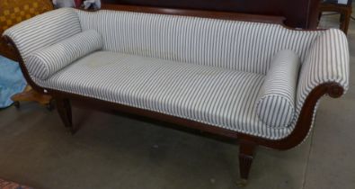 A Regency mahogany and upholstered scroll arm settee