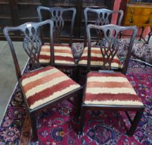 A set of four George III mahogany dining chairs