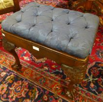 A Victorian carved walnut and upholstered stool