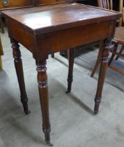A Victorian mahogany occasional table with brush and slides