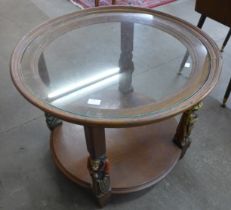 A French oak and glass topped circular two tier coffee table