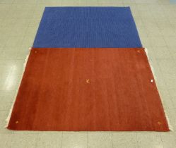 A red ground rug and a blue ground rug