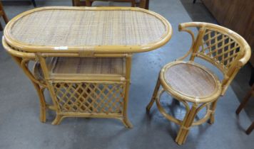 A bamboo and wicker table and two chairs