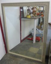 A large French style cream framed mirror