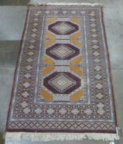 An eastern brown ground rug, 158 x 93cms
