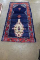 An Iranian blue ground prayer rug, 205 x 101cms