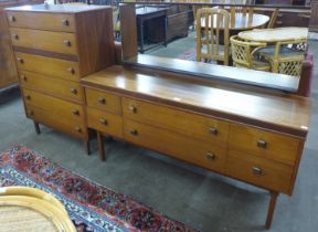A tola wood dressing table and matching chest of drawers