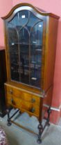 An early to mid 20th Century walnut display cabinet