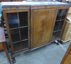 An Edward VII mahogany three door carved mahogany bookcase