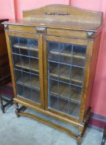 An early 20th Century oak two door bookcase