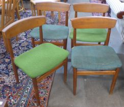 A set of four teak dining chairs