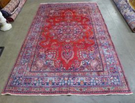 An eastern red ground rug, 290 x 195cms