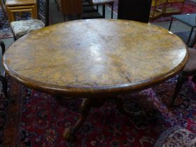 A Victorian inlaid walnut oval tilt-top centre table