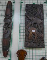 An African carved wooden wall mask and a carved elephant plaque