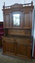 A 19th Century French Henry II style oak side cabinet