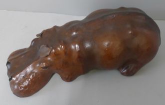 A small brown leather hippopotamus