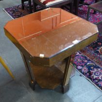 An Art Deco peach mirrored glass coffee table