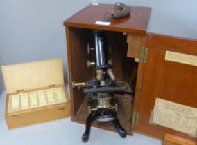 A vintage cased microscope with slides, W. Watson & Sons Ltd., London