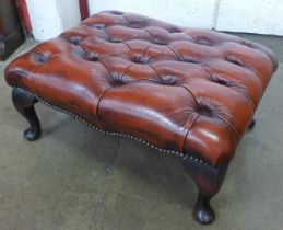 A Chesterfield red leather footstool