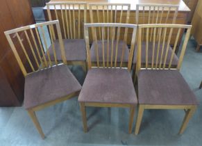 A set of six teak dining chairs