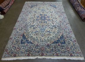 An eastern cream ground rug, 300 x 190cms