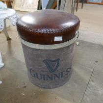 A brown leather and canvas Guinness advertising stool