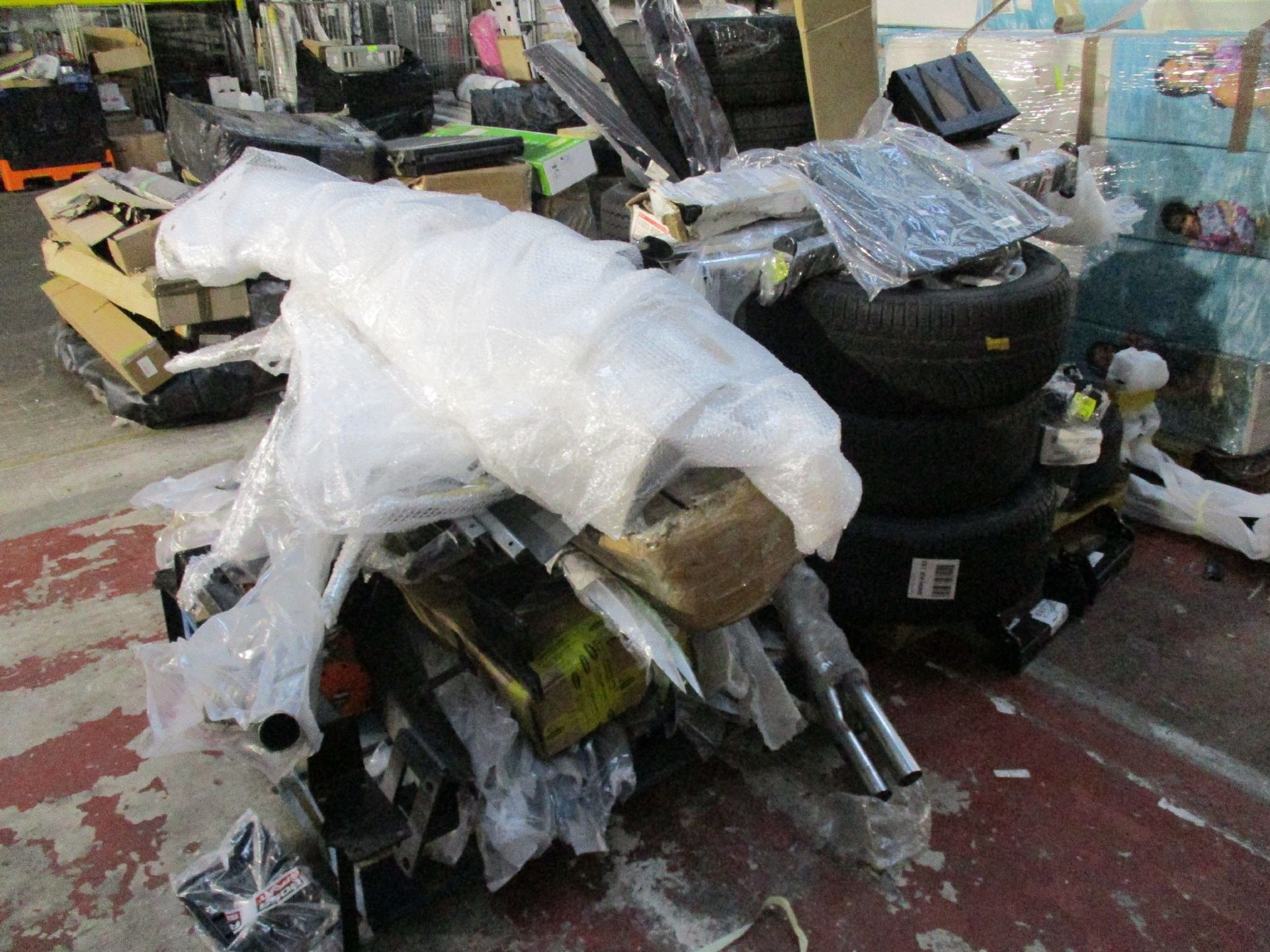 Two pallets of car parts and related items.