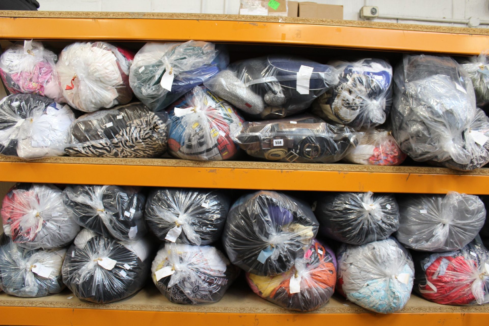 Twenty five bags of assorted pre-owned clothing and related.