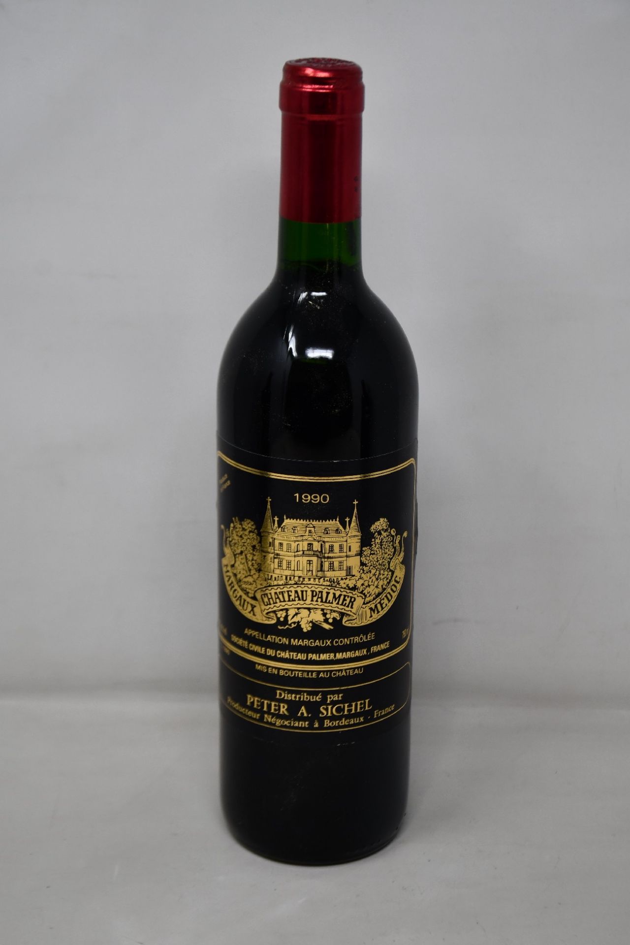 A bottle of 1990 Chateau Palmer Margeaux Medoc (Over 18s only).