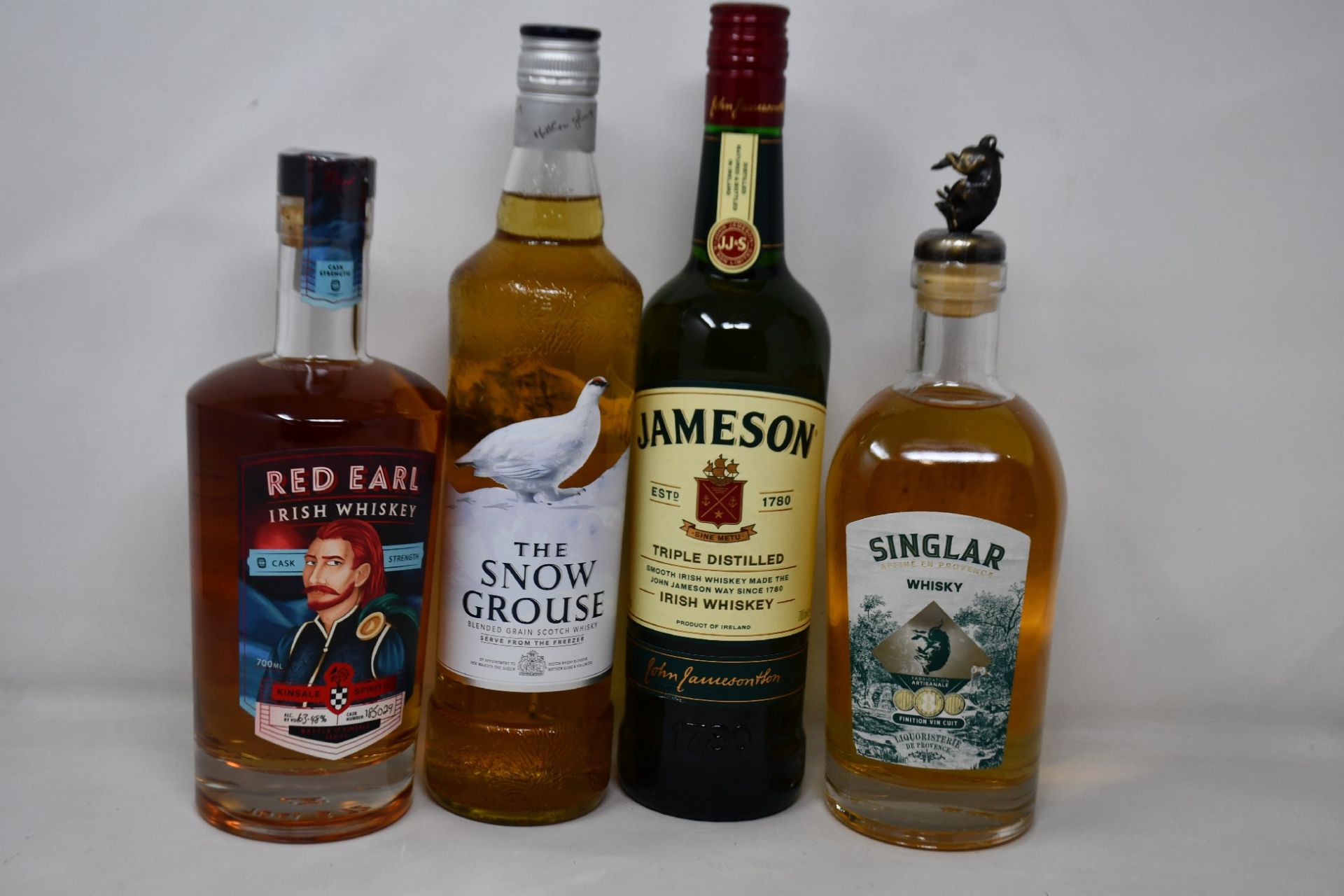 A bottle of Jameson Triple Distilled Irish whiskey (700ml), a bottle of Red Earl Irish whiskey (