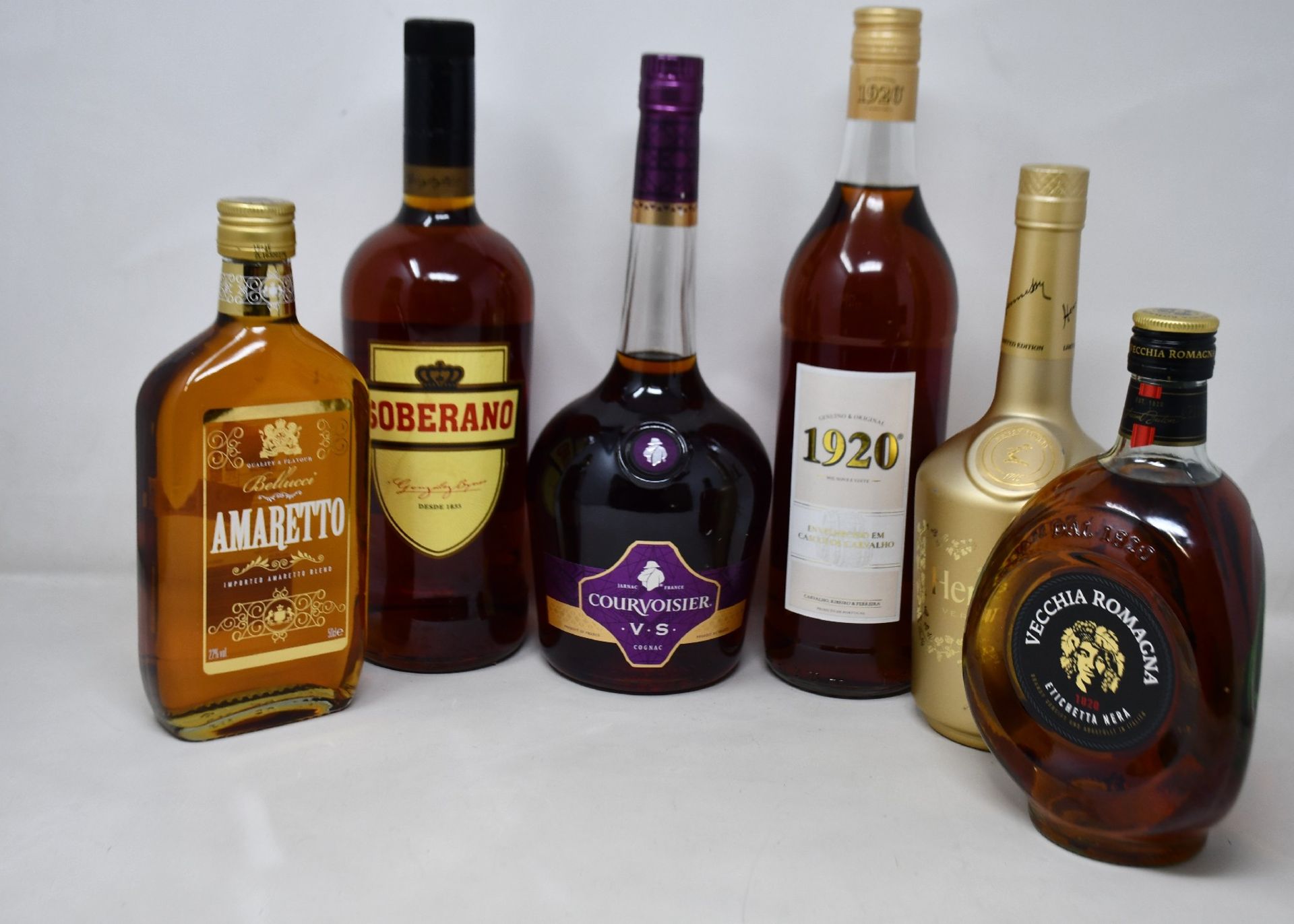 Eleven bottles of Brandy's to include Soberano, Courvoisier, Vecchia Romagna, Amaretto and