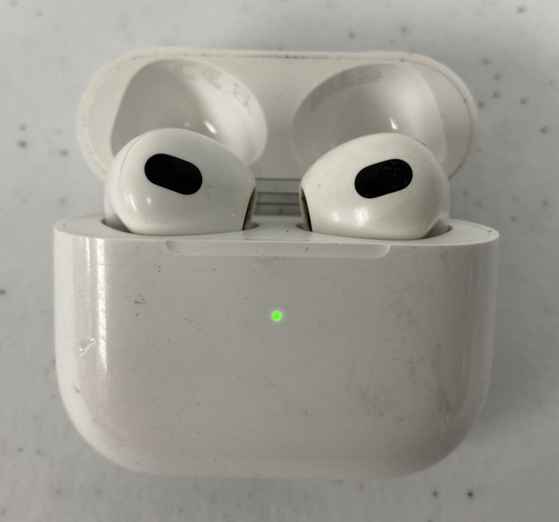 A pre-owned pair of Apple AirPods (3rd gen, A2565 + A2564) with MagSafe Charging Case (A2566) (Some