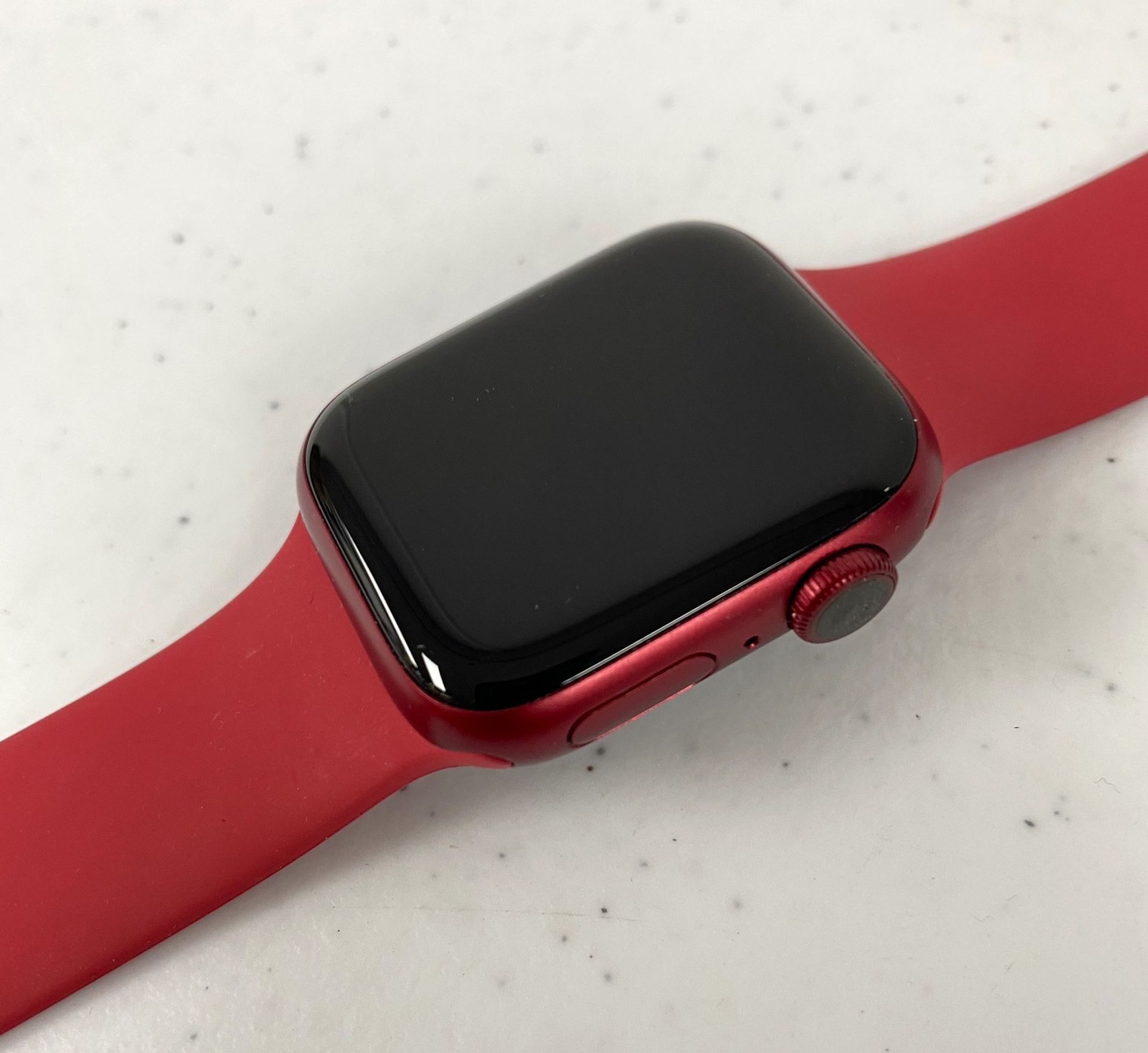 A pre-owned Apple Watch Series 7 GPS 41mm (PRODUCT)RED Edition Aluminium Case with M/L Red Sport Ban