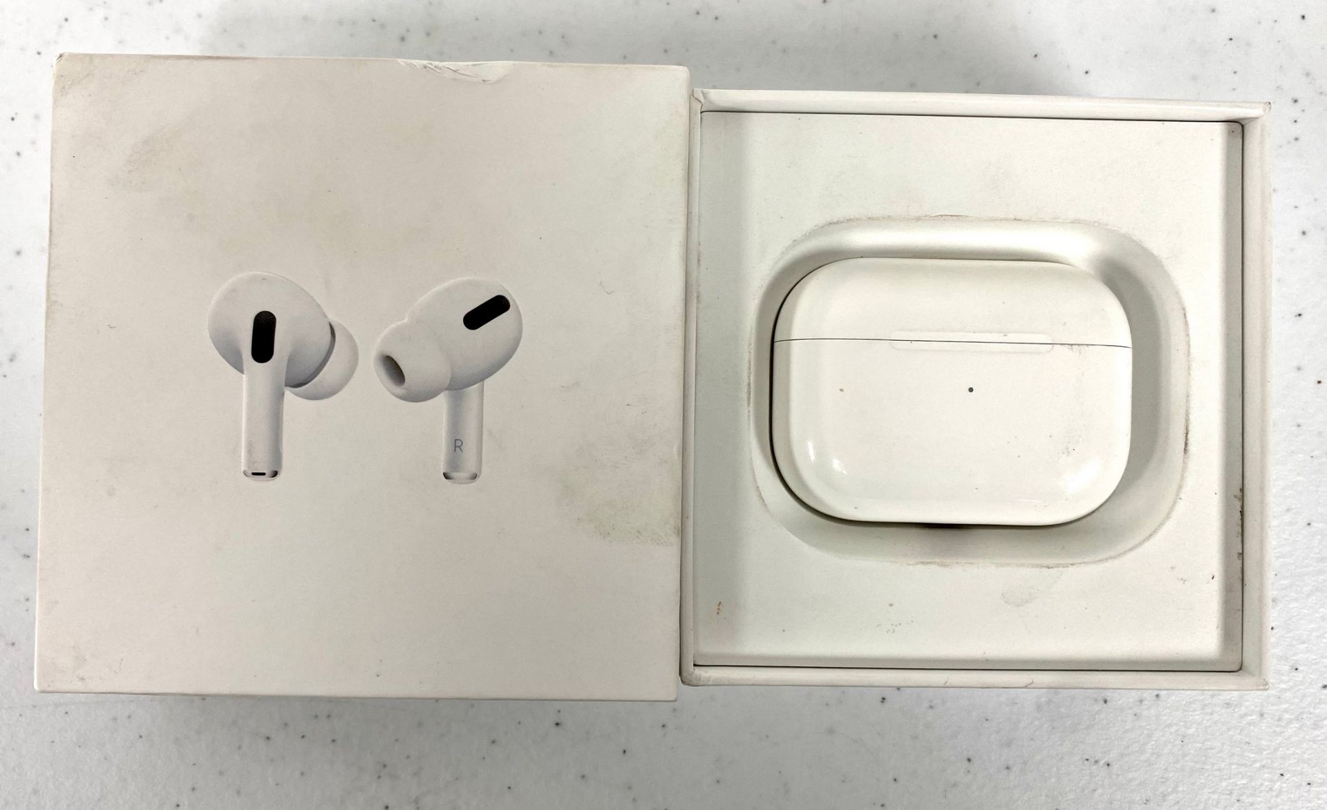 A pre-owned pair of Apple Airpods Pro (A2083+A2084) with MagSafe Charging Case (A2190) (Some cosmeti