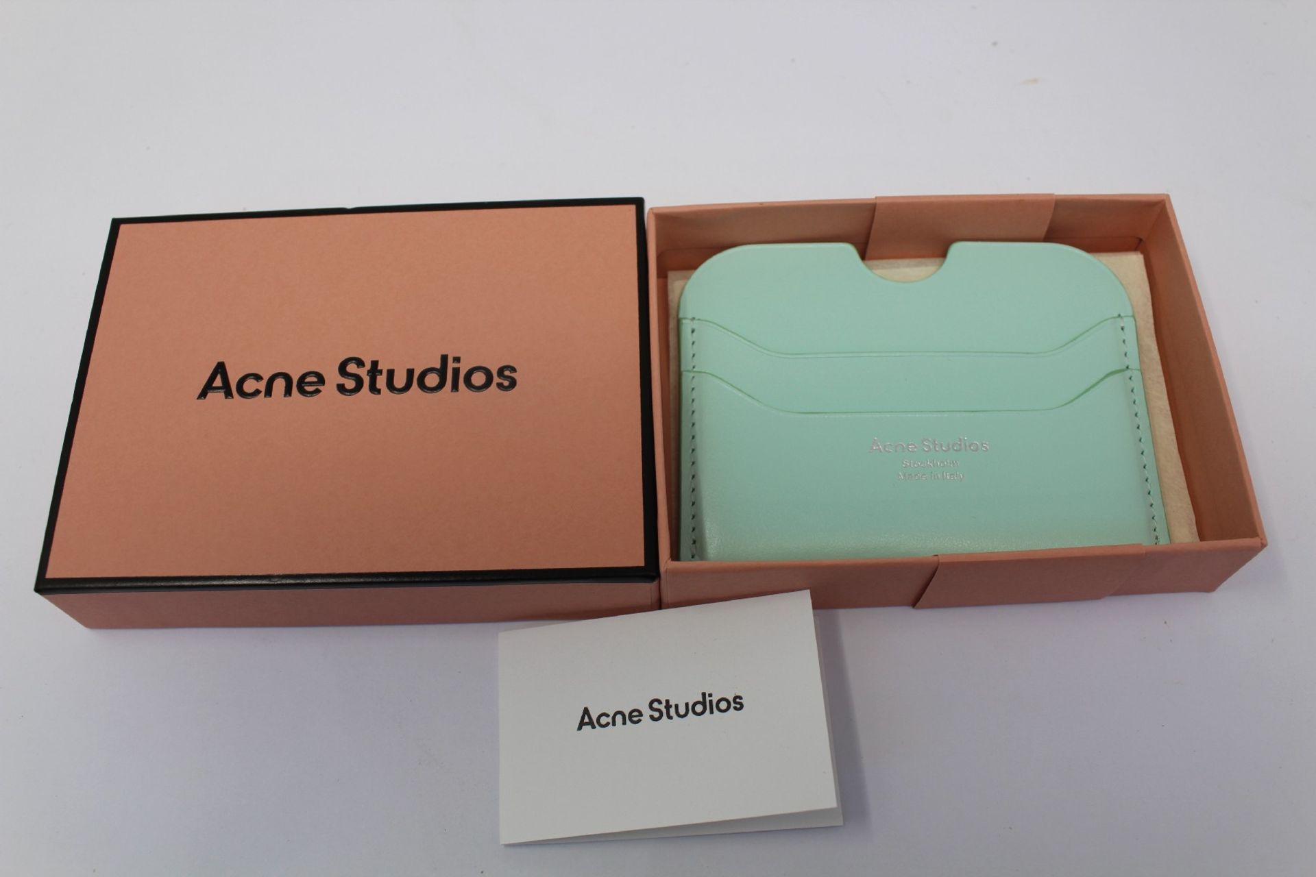 A boxed as new Acne Studios Leather Card Holder in Pastel Green.