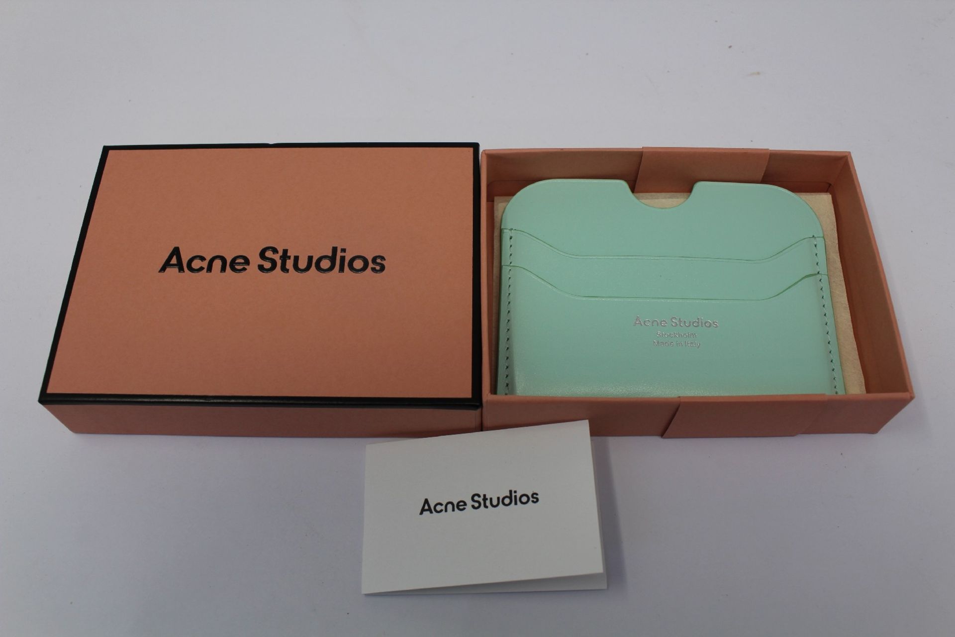 A boxed as new Acne Studios Leather Card Holder in Pastel Green.