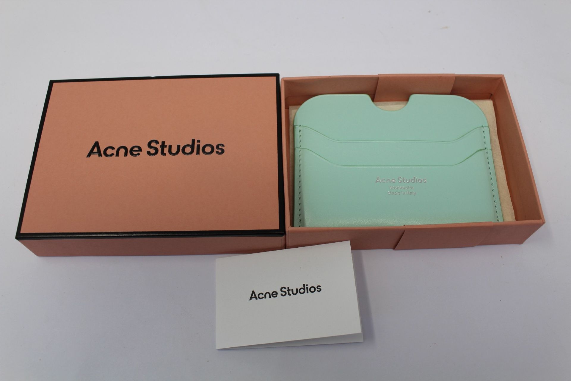 A boxed as new Acne Studios Leather Card Holder in Pastel Green.