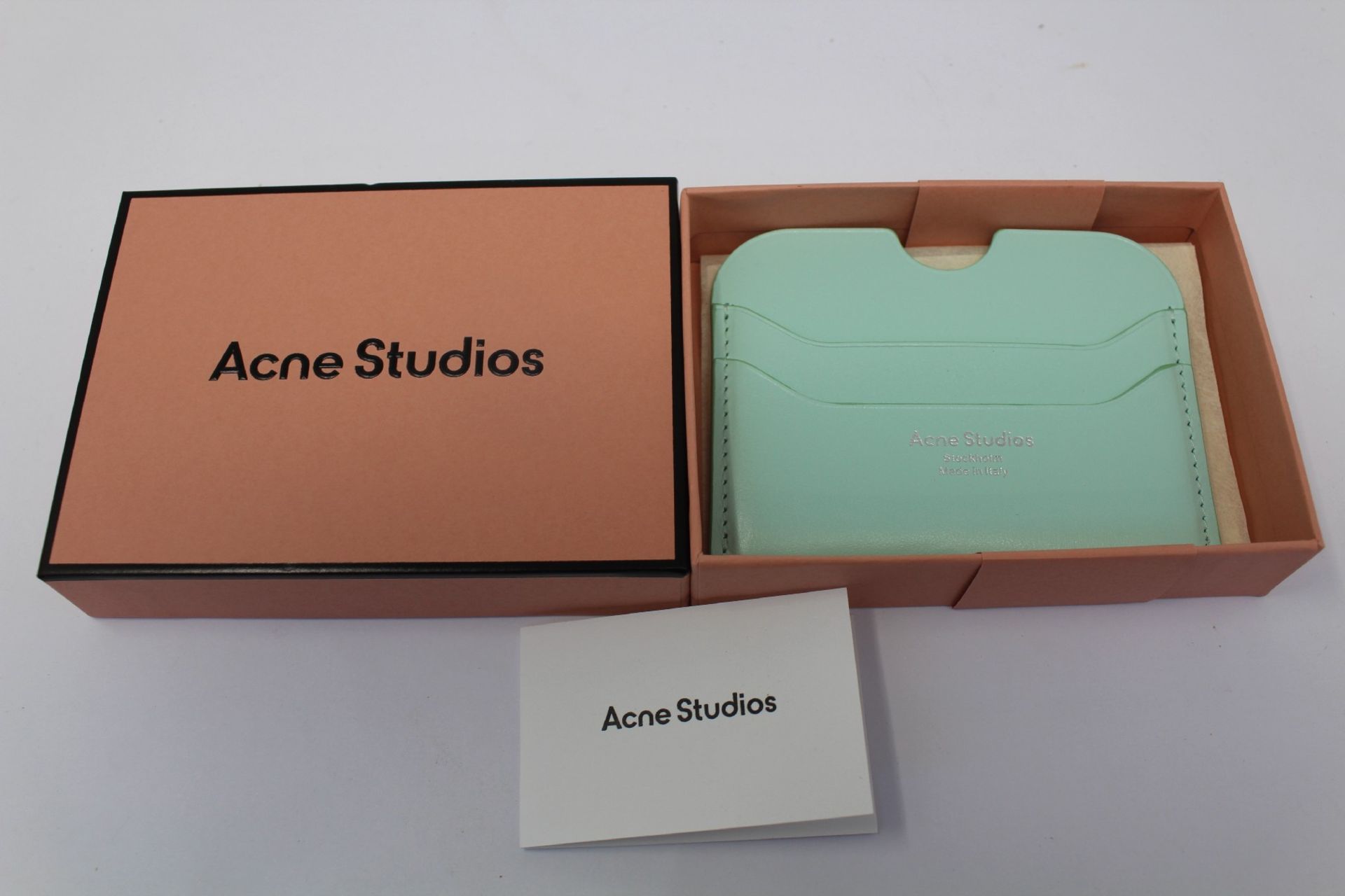 A boxed as new Acne Studios Leather Card Holder in Pastel Green.