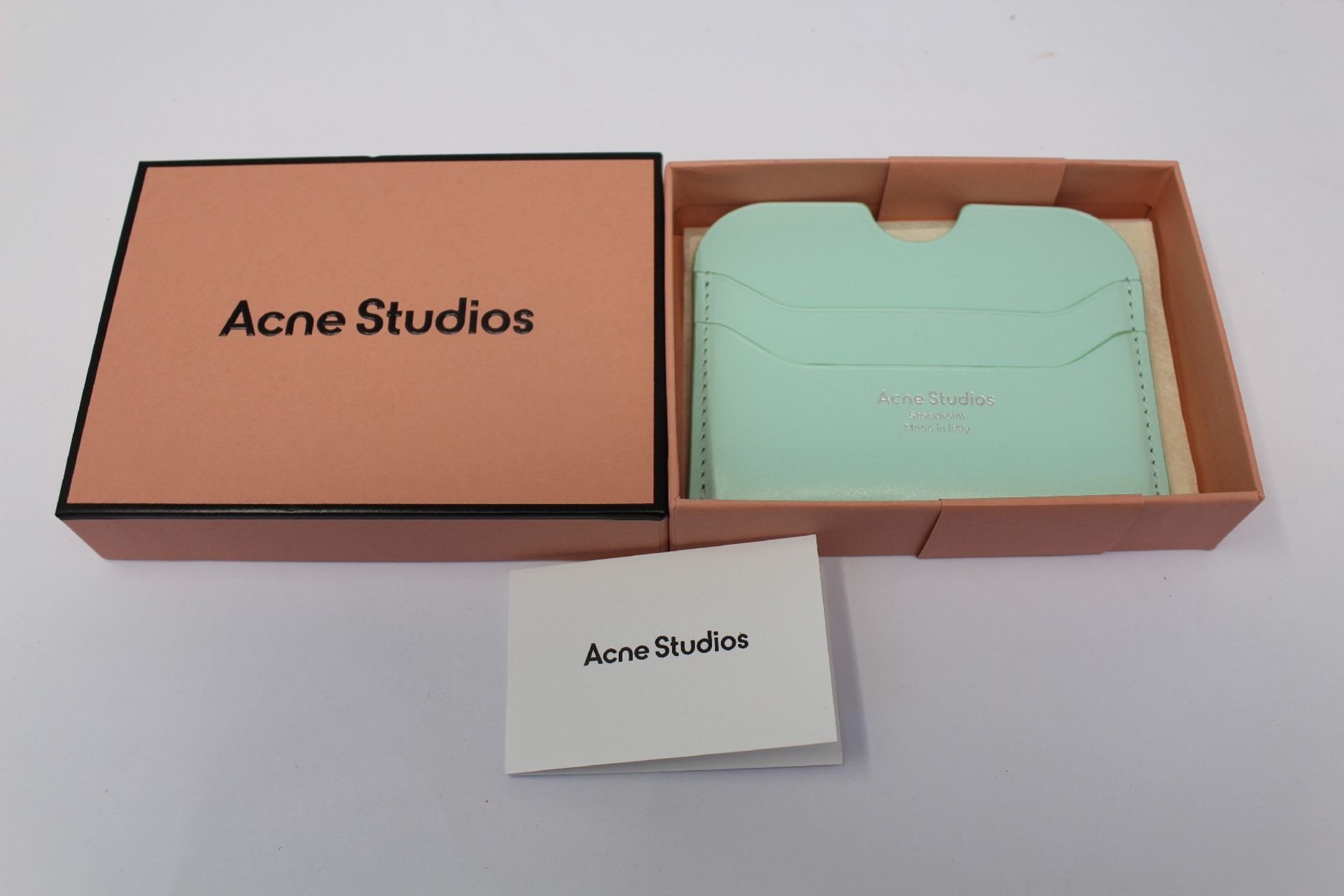 A boxed as new Acne Studios Leather Card Holder in Pastel Green.