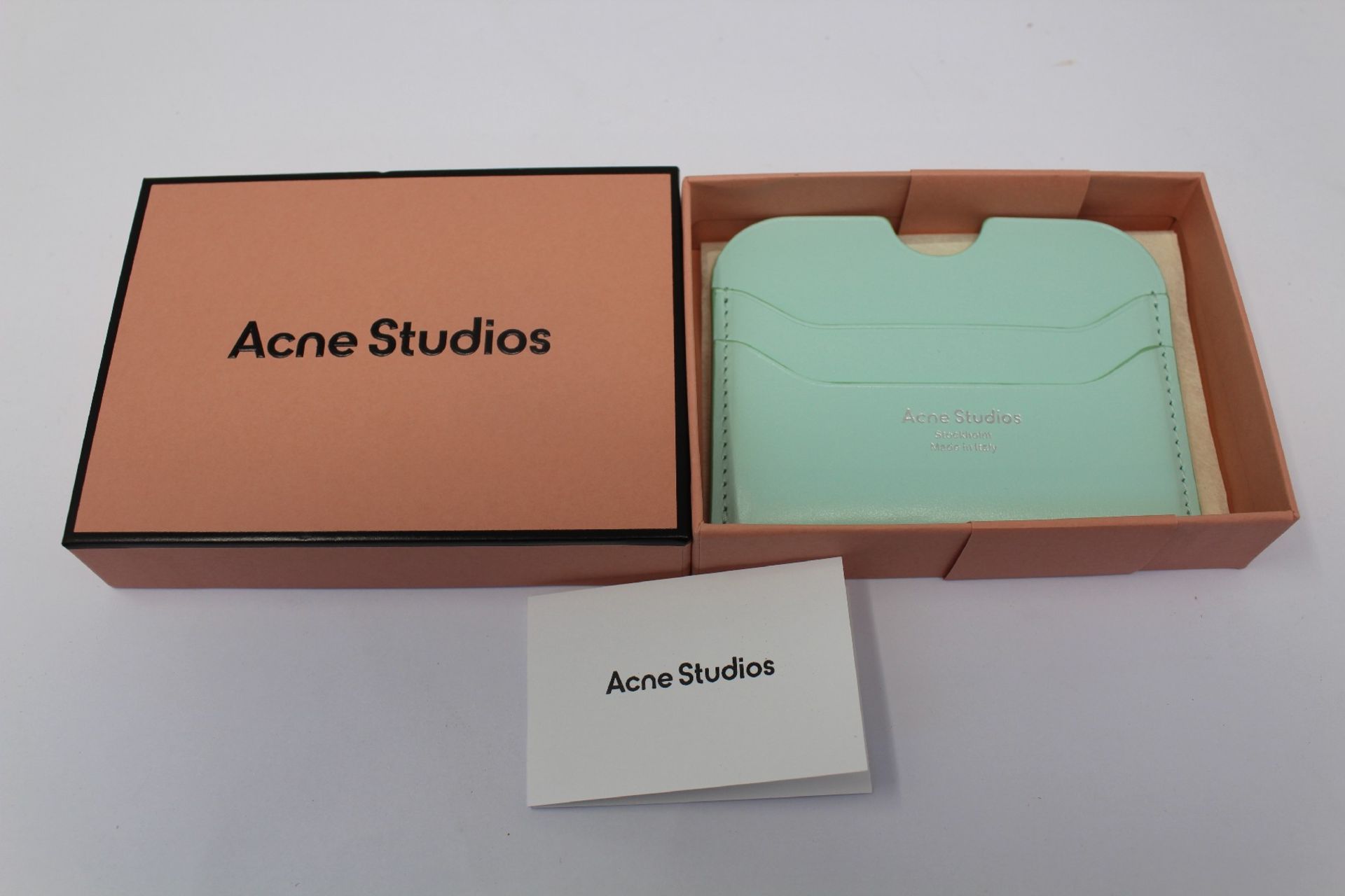 A boxed as new Acne Studios Leather Card Holder in Pastel Green.