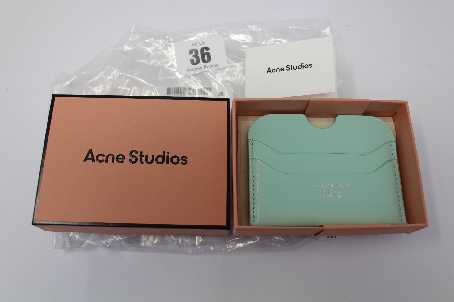 A boxed as new Acne Studios Leather Card Holder in Pastel Green.