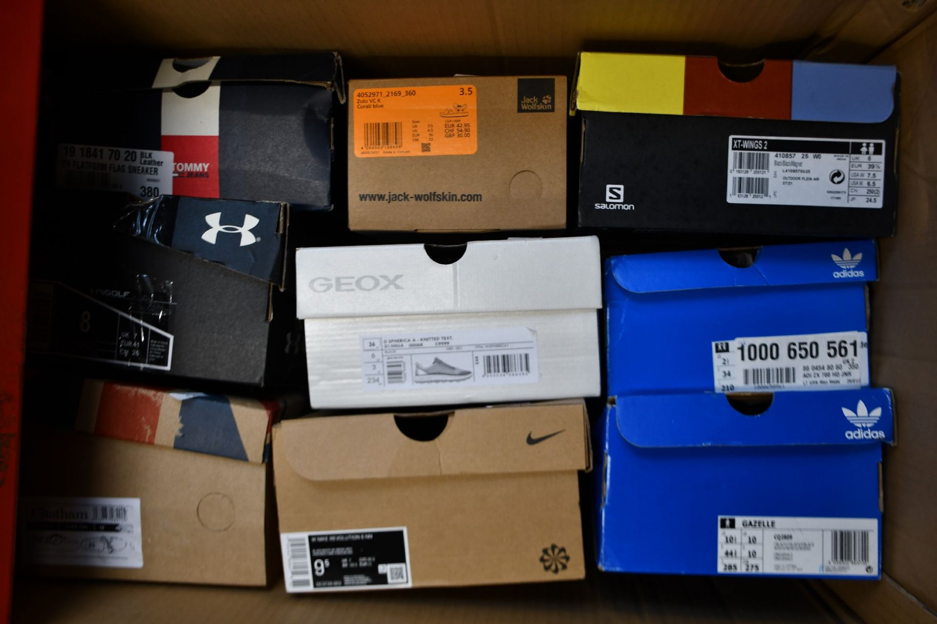 Nine pairs of assorted as new shoes, trainers and related to include Salomon, Jack Wolfskin, Nike,