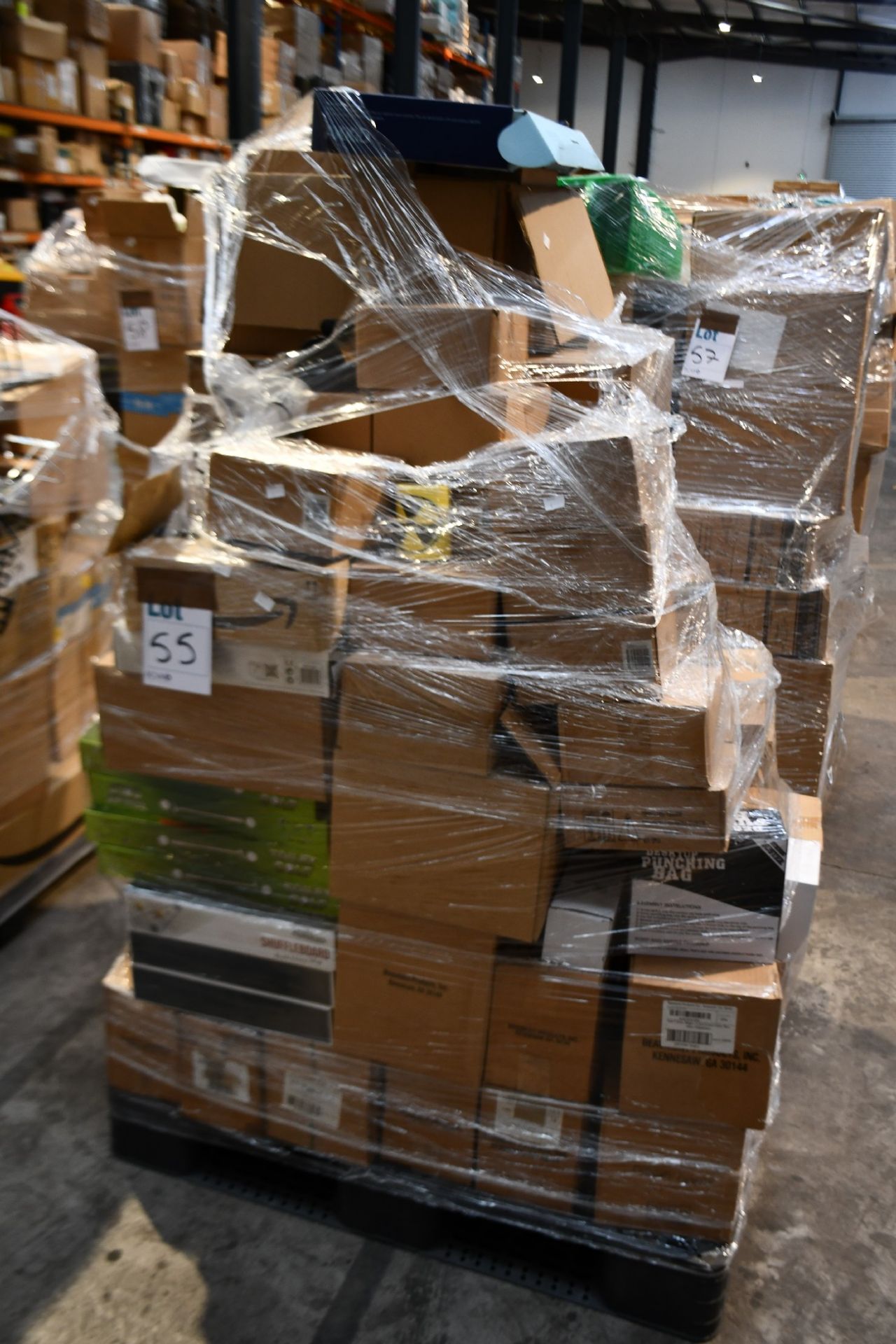 A pallet of assorted as new miscellaneous items to include desktop punch bags, drinking roulette,