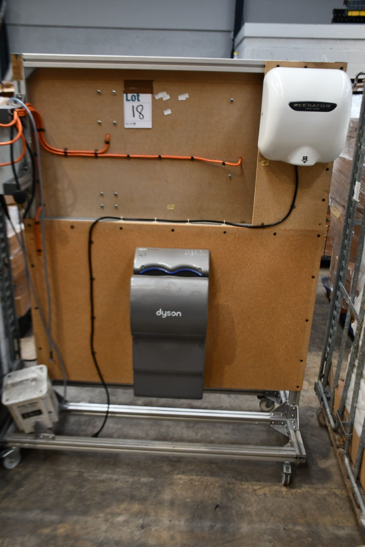 A display rig with hand dryers including Dyson and Airblade in various styles and Xlerator Excel