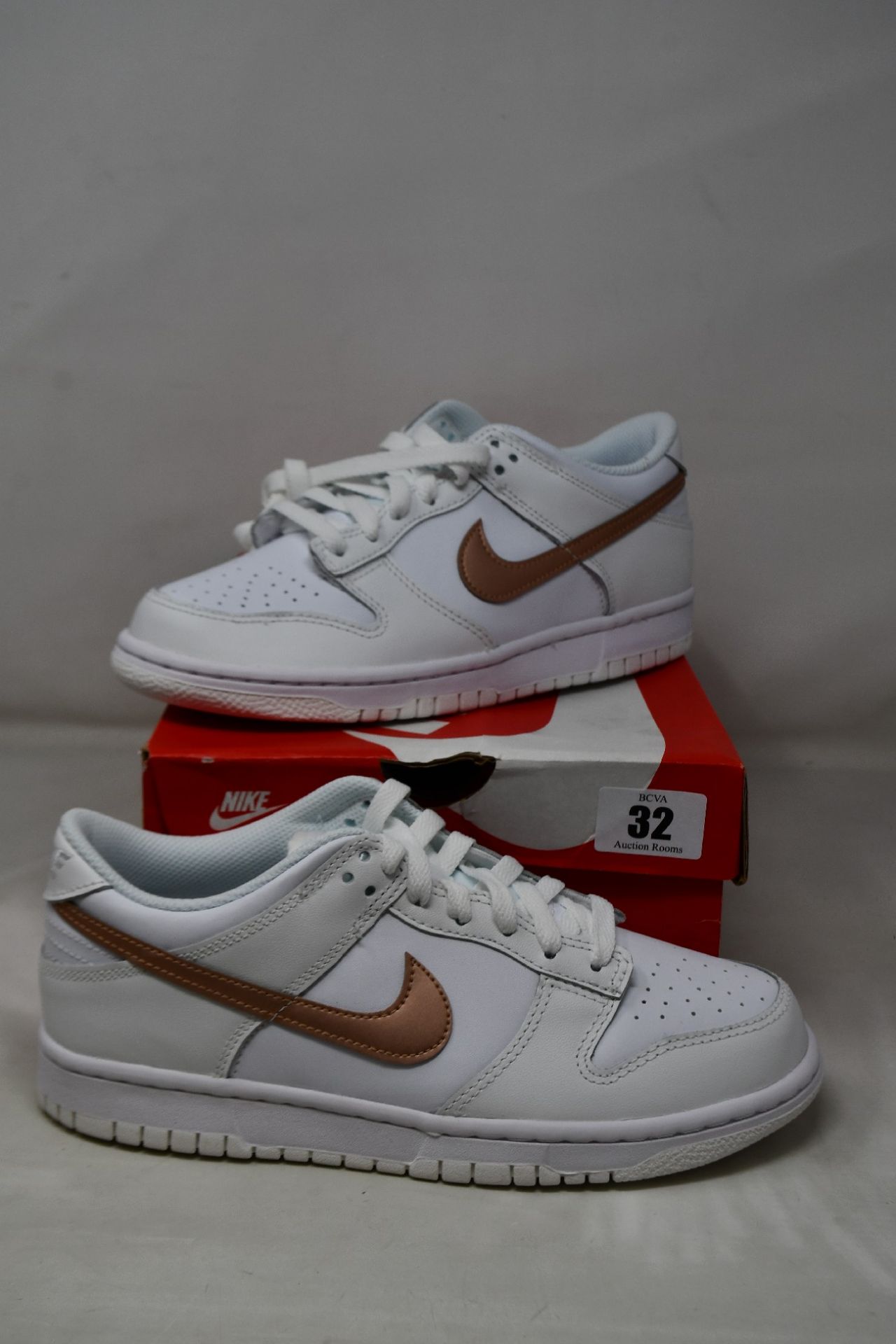 A pair of boxed as new Nike Dunk Low (GS) White/Metallic Red Bronze (UK 6).