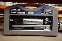 A boxed Meade lunar observer and imager