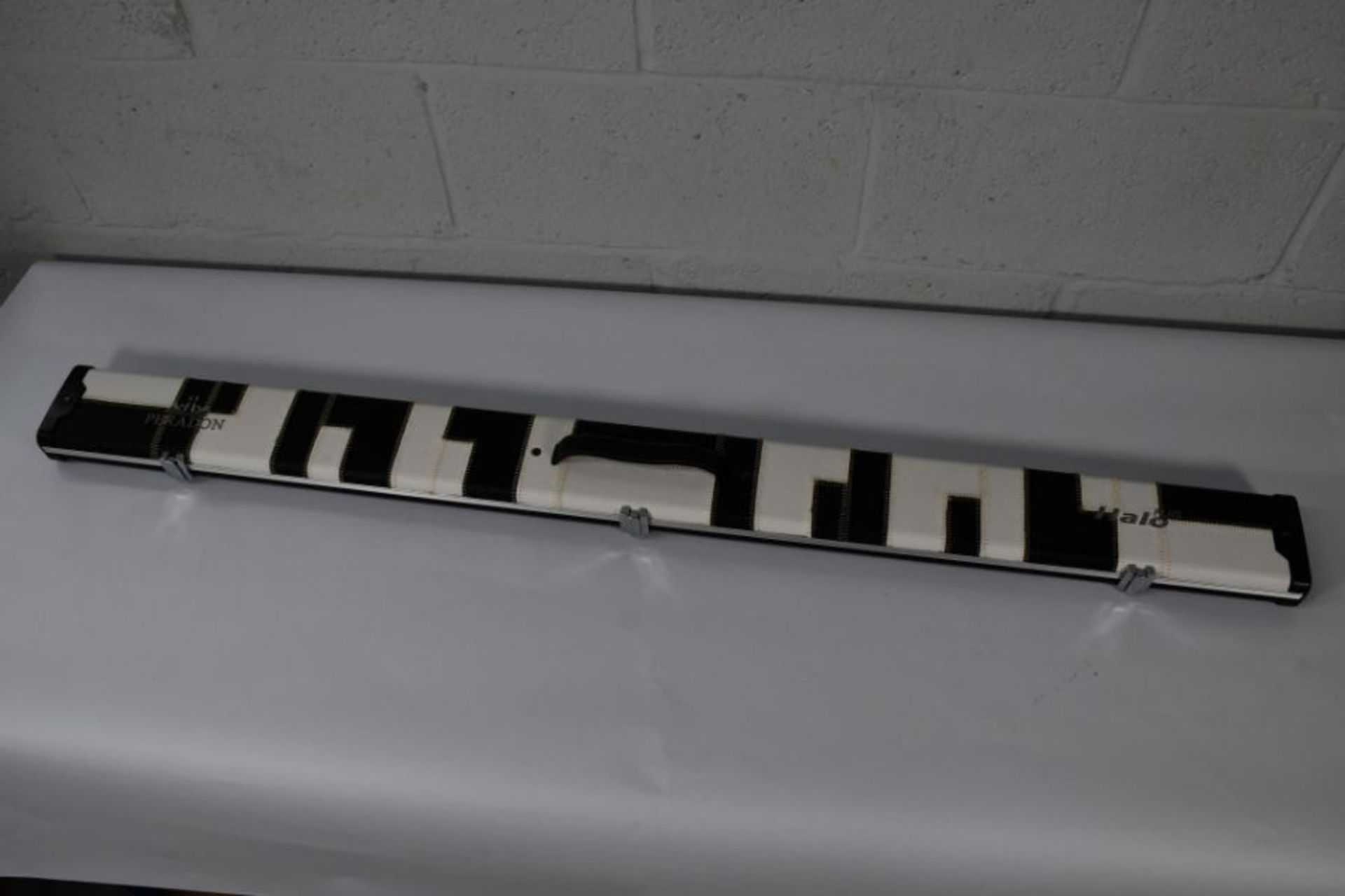 An as new Peradon Halo 3/4 plus Black and white patches cue case