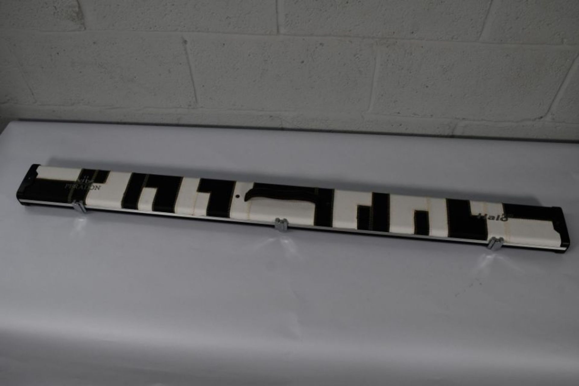 An as new Peradon 3/4 Halo Plus black and white patches cue case