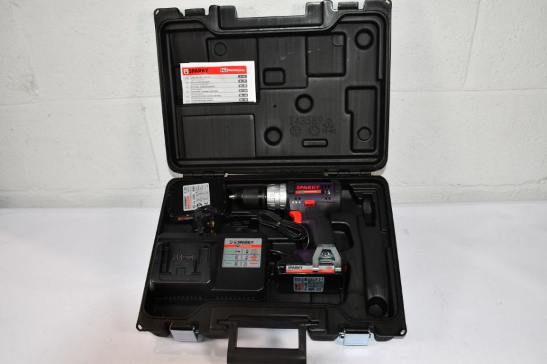 A boxed as new Sparky cordless drill with battery and charger.