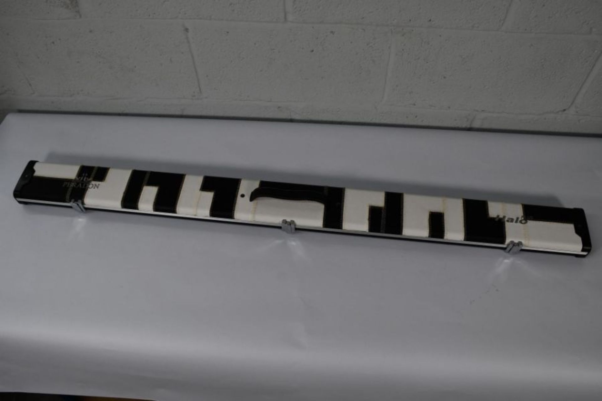 An as new Peradon Halo 3/4 plus Black and white patches cue case